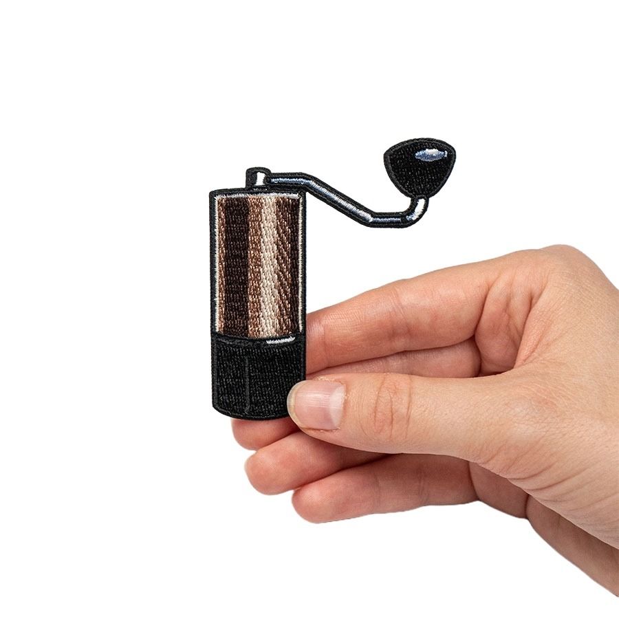 Comandante Mini C40 Grinder tygmärke